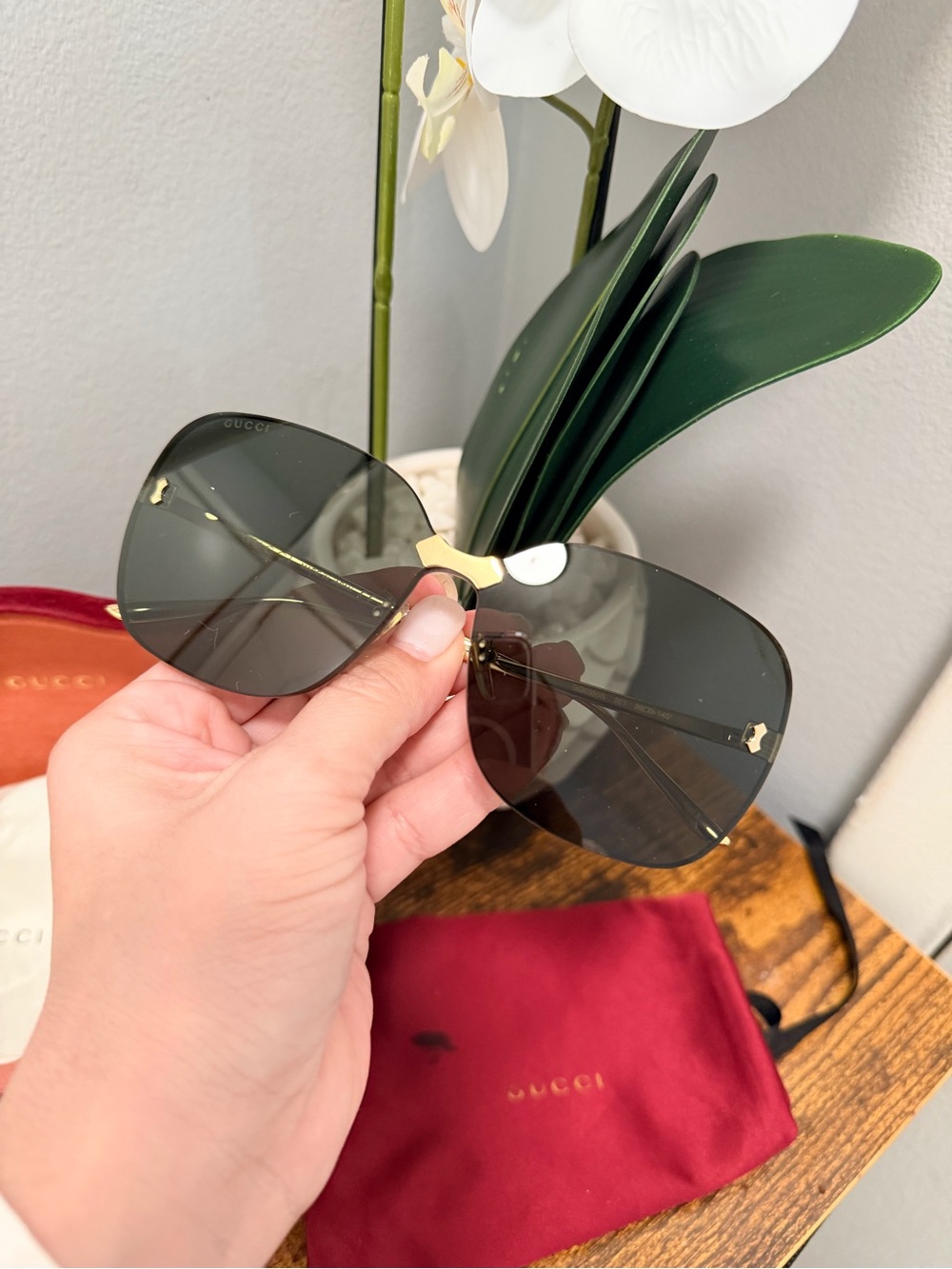 Gucci Women's Dark Gray Rimless Sunglasses with Gold Accents